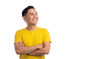 Handsome young Asian man standing with crossed arms, looking aside with a confident smile isolated...