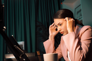 An unhappy sitting businesswoman with stressful feeling's headache and eyestrain for over thinking...
