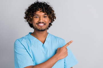 Photo of experienced doctor guy point finger copyspace isolated grey color background