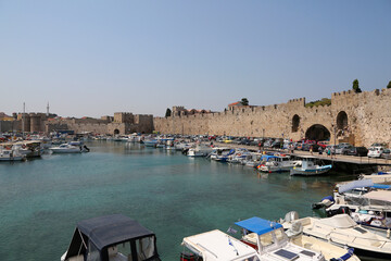 Rhodes, Greece - August 10, 2017: View from the sea to the fortress of the city of Rhodes, Greece. - obrazy, fototapety, plakaty