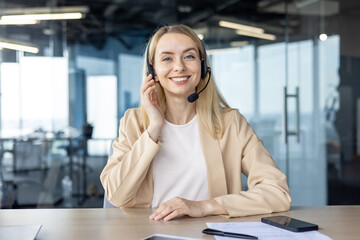 Professional woman with headset smiling in modern office