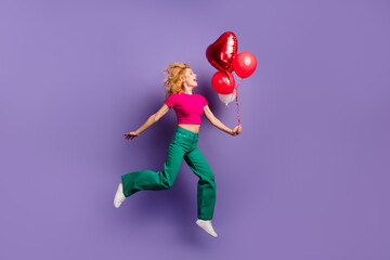 Photo of funny funky adorable woman wear stylish pink clothes running empty space isolated on purple color background