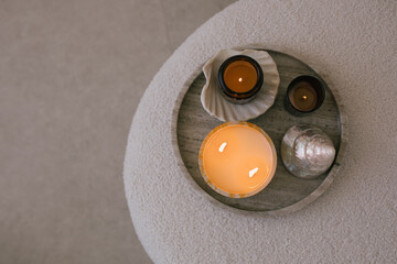 Aromatic candles on a natural marble tray.