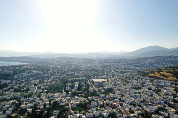 Bodrum city aerial shot. Aegean sea, traditional white houses, flowers, marina, sailing boats,...