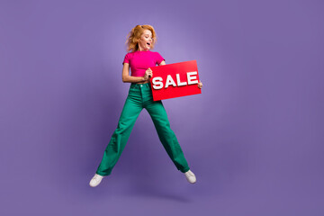 Photo of charming lovely woman wear trendy pink clothes hands hold look banner sale isolated on purple color background