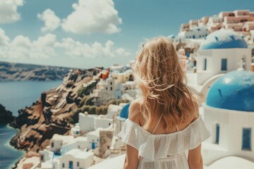 Fototapeta na wymiar As the sun painted the sky with hues of orange and pink, we found ourselves lost in the beauty of the view on Santorini island, a perfect backdrop to the elegant architecture