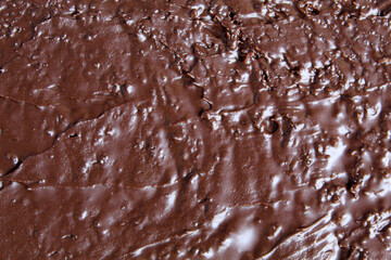 Background texture of chocolate spread, chocolate jam or melted chocolate