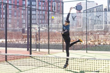 Portrait of a european man padel tennis player playing on the outdoor court