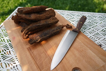 Biltong is a form of dried, cured meat which originated in Southern African - obrazy, fototapety, plakaty
