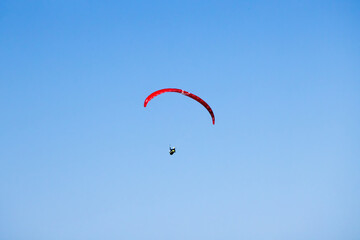 Solo flight in a blue sky