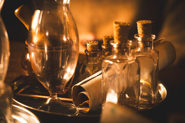 The ancient alchemy recipe with medieval glasses flasks and bottles.