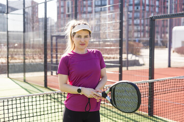 One women playing Paddle tennis