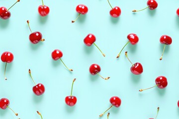 Vibrant Red Cherries Scattered on a Soft Blue Background for Fresh Summer Design