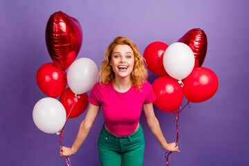 Photo of cheerful adorable cute woman wear trendy pink clothes hold helium balloons isolated on...