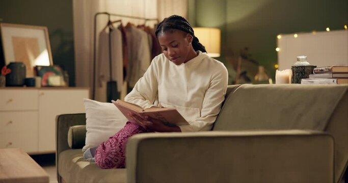 Woman, relax and reading a book in apartment at night on holiday or vacation with romance story. Fantasy, fiction and girl learning with poetry in literature, language and study of knowledge in home