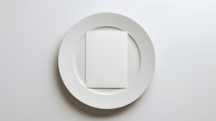 A white plate with a blank card on it