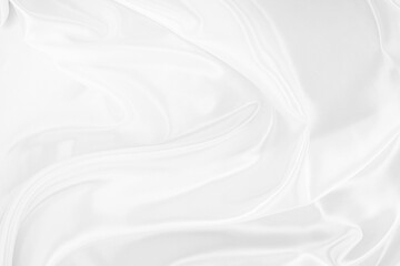 White gray satin texture that is white silver fabric silk background with beautiful soft blur...