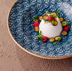 Elegant vanilla panna cotta with fresh berries