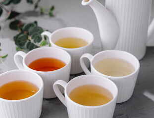 Variety of teas in white ceramic cups