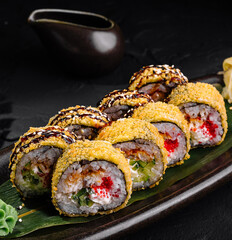 Delectable sushi rolls plated on dark slate background