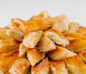 Freshly baked puff pastry bites close up