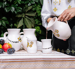Traditional table setting with handmade ceramic pitchers