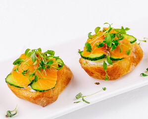 Fresh salmon canapes with microgreens