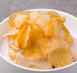 Bowl of crispy golden potato chips