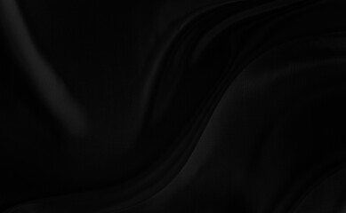 Black gray satin dark fabric texture luxurious shiny that is abstract silk cloth background with patterns soft waves blur beautiful.