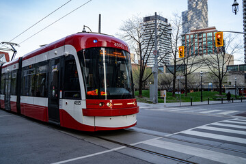Naklejka premium Streetcar in Toronto Downtown. Toronto, Canada - April 29, 2024.