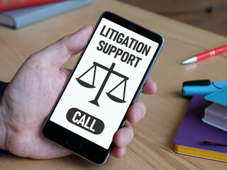 Litigation support is shown using the text on the screen of smartphone