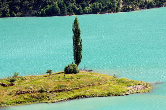An island on the reservoir of the Zaramag hydroelectric power station in the Kassar gorge. North Ossetia - Alania. Russia