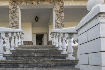 Exterior stairs of a single-family home with prefabricated white balustrades