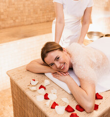 Soap massage of beautiful woman in hammam. Procedures in Turkish bath improves the skin and stops aging process