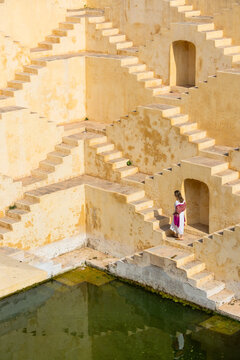 Woman at ancient stepwell in Jaipur