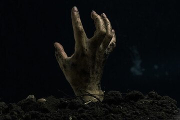 Hand of zombie on a black background. Halloween concept. Copy space.