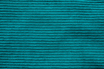Closeup of turquoise corduroy cloth as patterned textured background