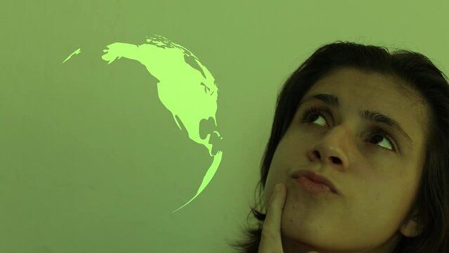 Woman thinking how she could help the planet. Earth planet icon spinning on the side of a thinkful woman.