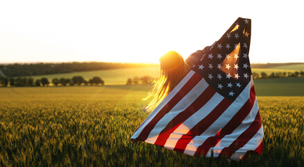 Independence Day. Beautiful girl with the American flag in a wheat field at sunset. 4th of July. Patriotic holiday, american day.
