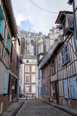 Beautiful street with traditional French buildings with wooden beams and colorful, surroundings of...