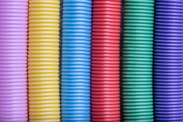 Close up of colorful plastic springs. Colorful background and texture.