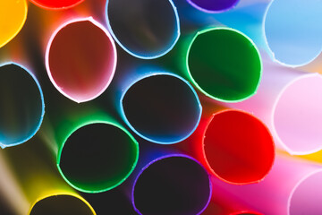 Colorful plastic drinking straws background. Closeup shot.
