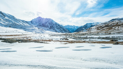 Footprints of travelers on snowy mountains