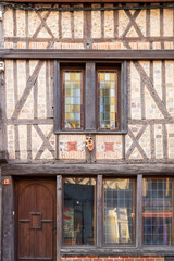 Fototapeta premium Rue du 27 Juin, L'art rue, beautiful street with traditional French buildings with wooden beams and colorful, surroundings of La Cathédrale Saint-Pierre, Beauvais, France.