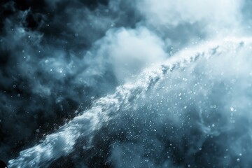 A powerful water splash captured in high contrast blue tones, surrounded by mysterious light...