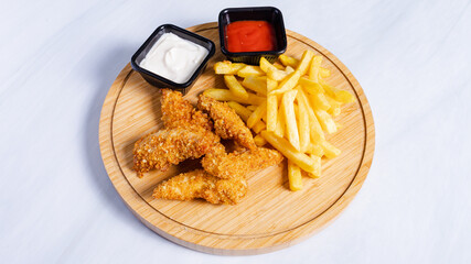 Fries and chicken nuggets on tray