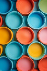 Abstract image with vibrant colors school blue, recess green, playful pink, snacktime orange. Circular designs on a colorful background.