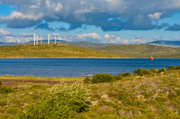 Fototapeta na wymiar wind farm on the coast of Mersin Koyu inlet near Alacati (Izmir province, Turkiye)