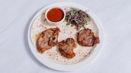 Lamb kebab on plate top view