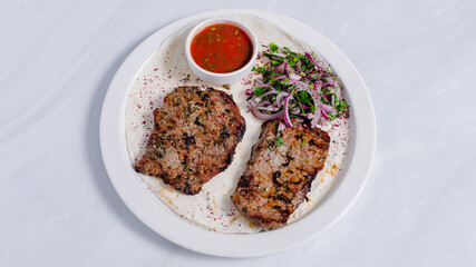 Beef kebab on plate top view